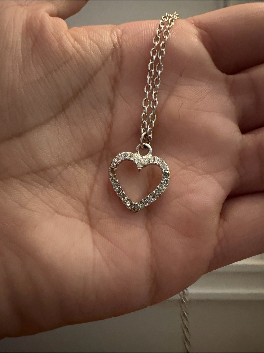 Claire's silver-tone crystal open heart necklace